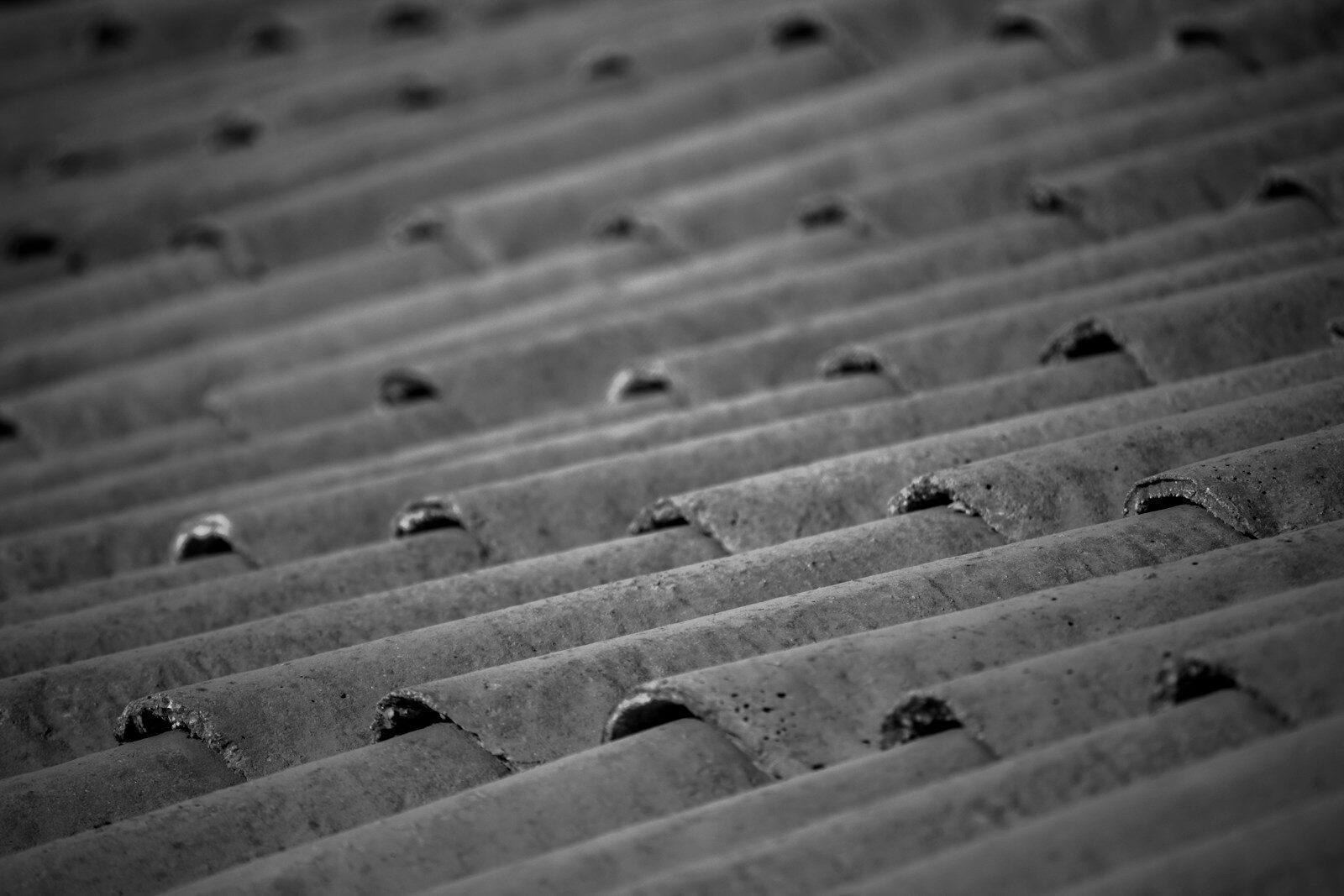Close-up of a weathered, corrugated metal roof.