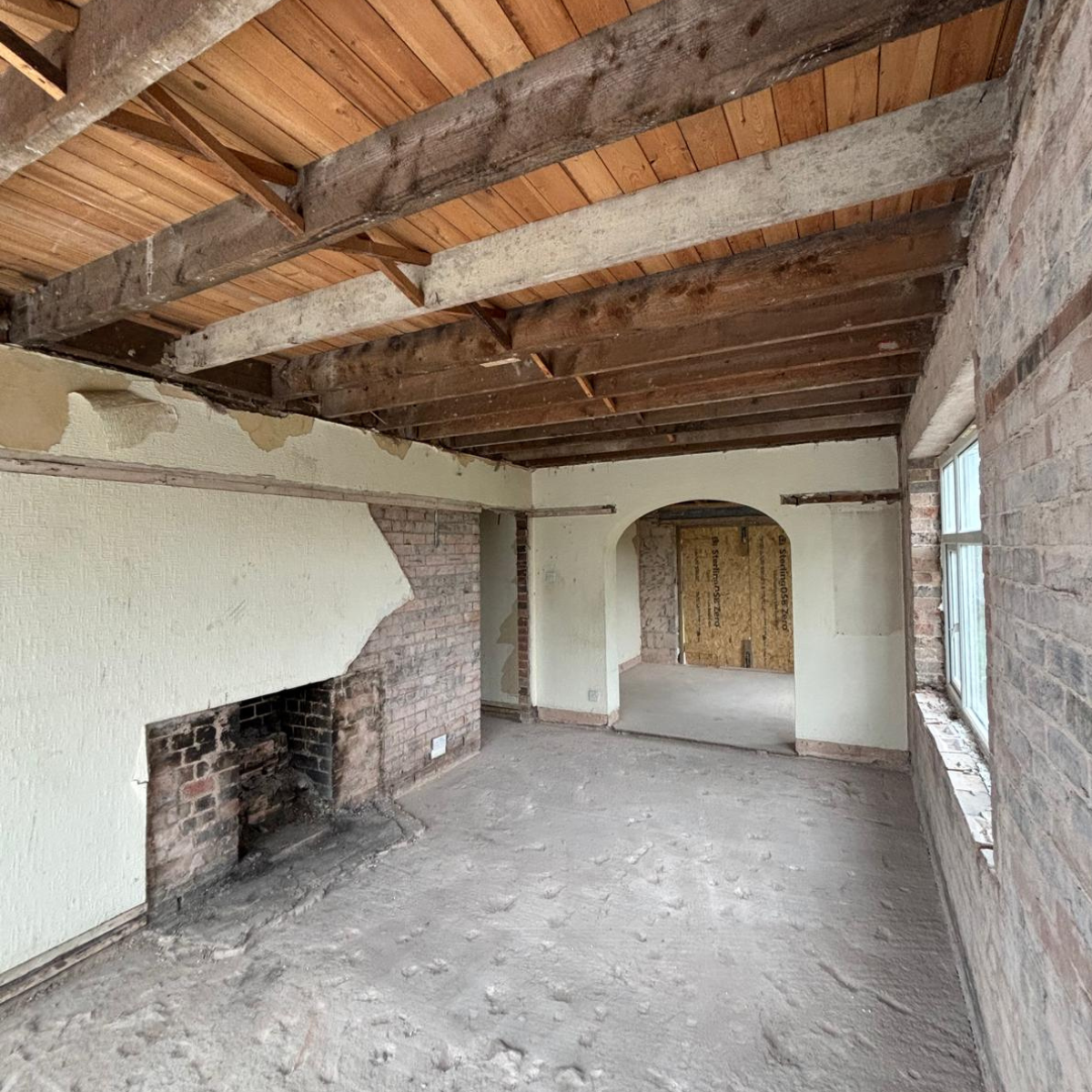 A building mid-renovation, showing a temporary access point.