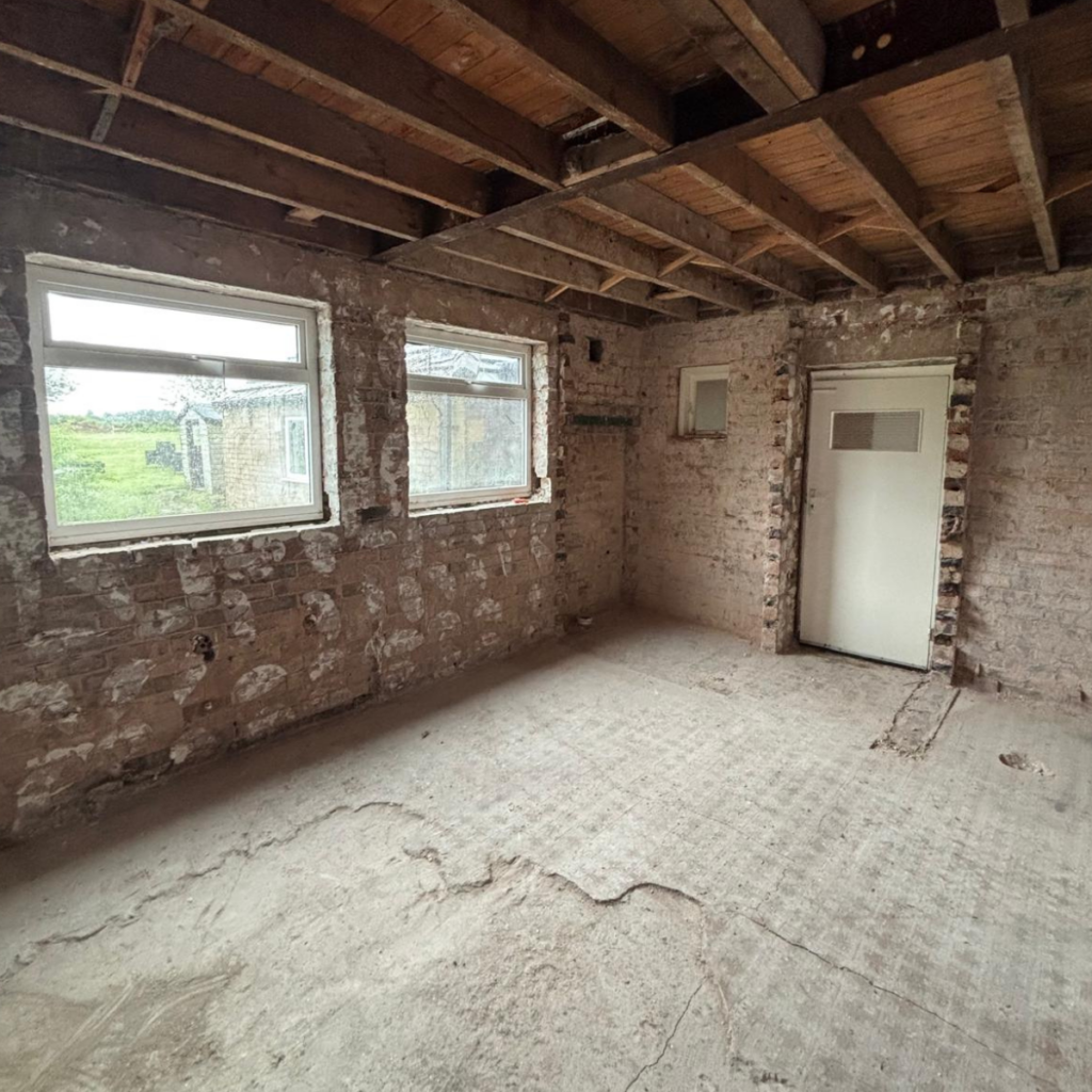 A room that has been taken back to brick