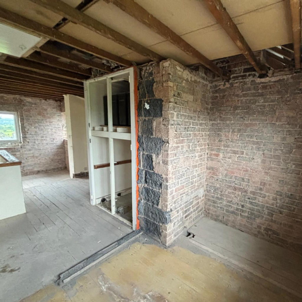 A landing that has been taken back to brick