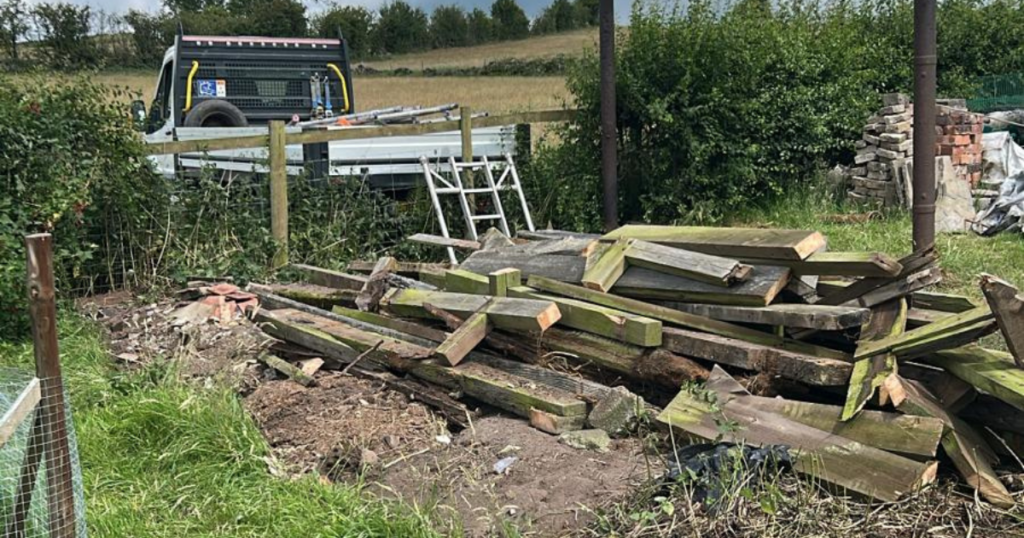 A demolished barn on a farm site