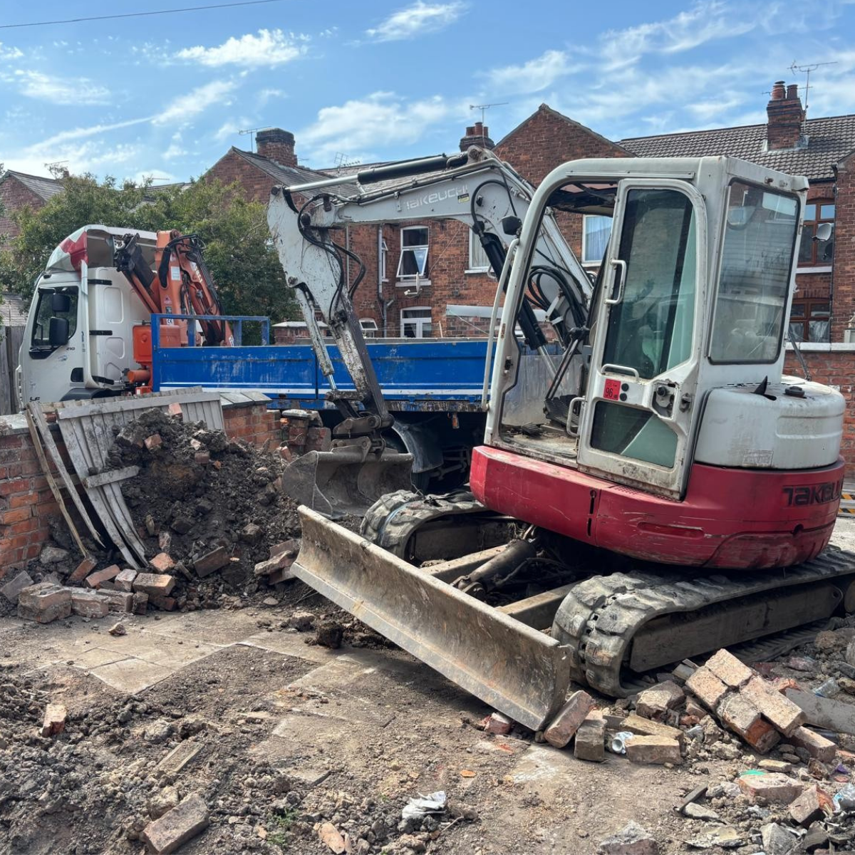 An excavator and 7.5t lorry on a site clearance project.